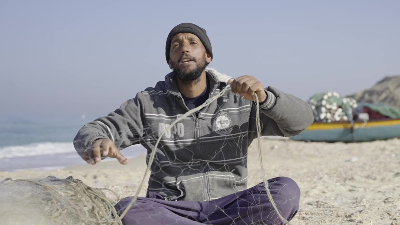 Ismail Mohamed, 35, prepares his fishing nets in Deir Al-Balah, Gaza.