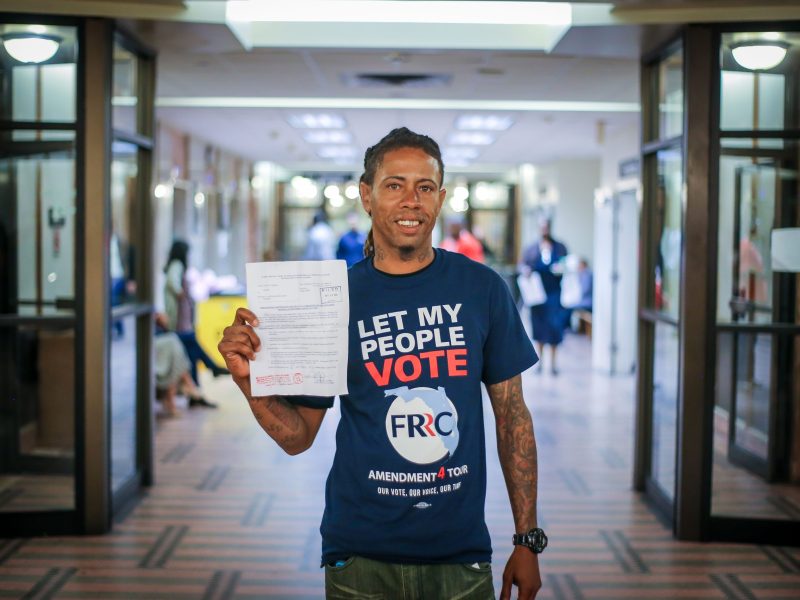 Michael Monfluery, 38, who has never been eligible to vote, stands in a courthouse corridor following special court hearing aimed at restoring the right to vote under Florida's amendment 4 in a Miami-Dade County courtroom on November 8, 2019, in Miami, Florida. Photo by ZAK BENNETT/AFP via Getty Images