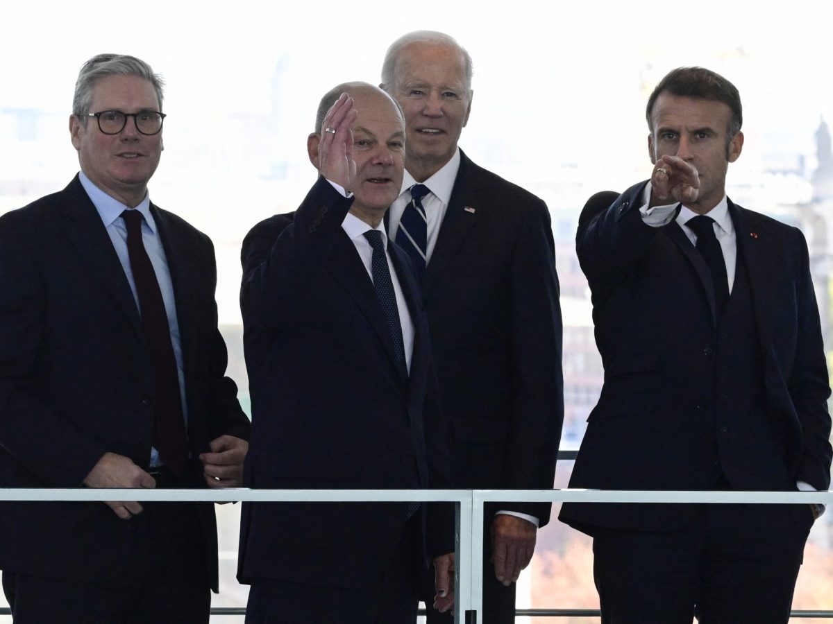 German Chancellor Olaf Scholz (2ndL) speaks with (LtoR) British Prime Minister Keir Starmer, US President Joe Biden and French President Emmanuel Macron before their Quad meeting at the Chancellery in Berlin, on October 18, 2024. Photo by JOHN MACDOUGALL/POOL/AFP via Getty Images