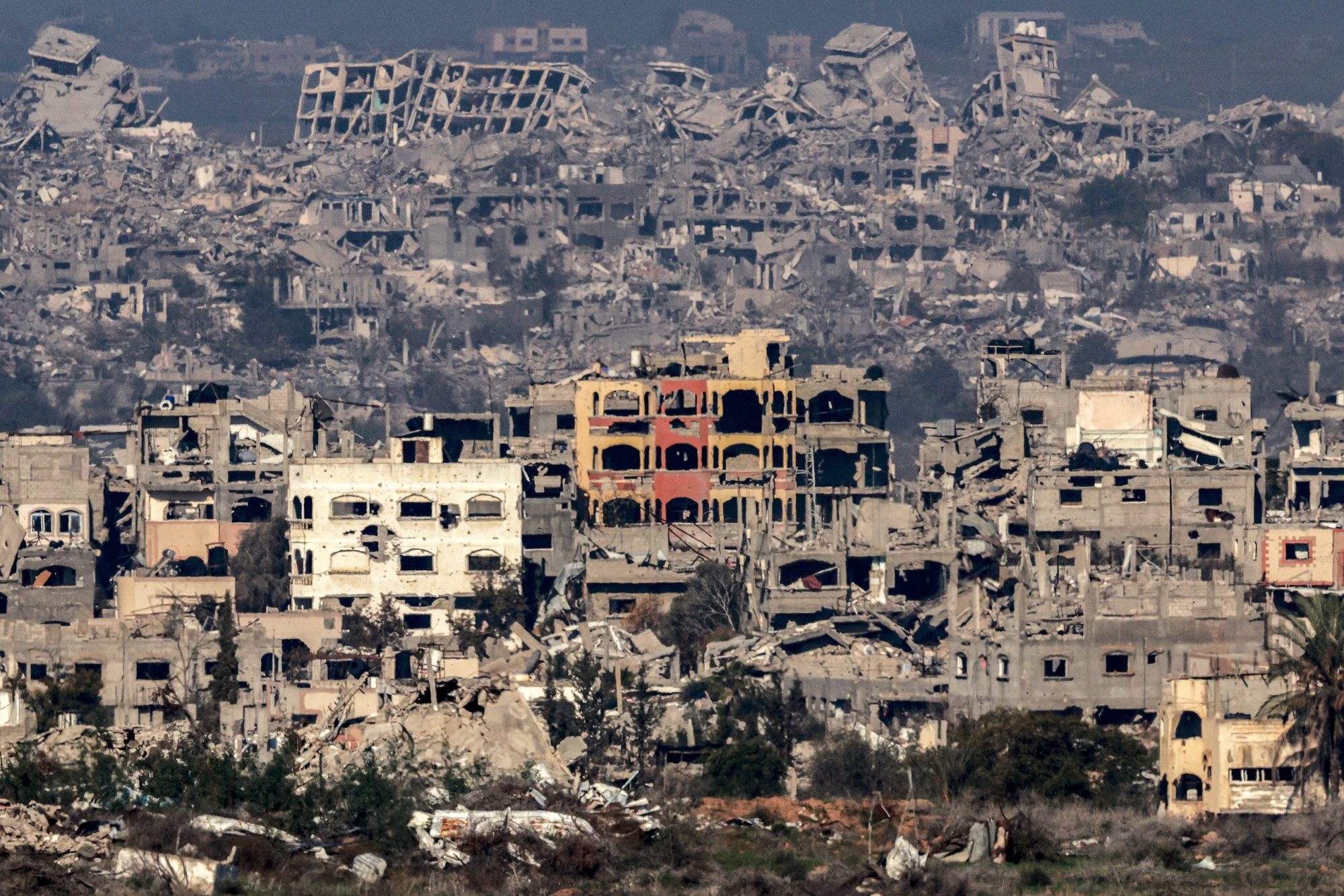 This picture taken from the Israeli side of the border with the Gaza Strip shows destroyed buildings in the northern Gaza Strip on January 13, 2025 amid the ongoing war between Israel and Hamas. Photo by MENAHEM KAHANA/AFP via Getty Images