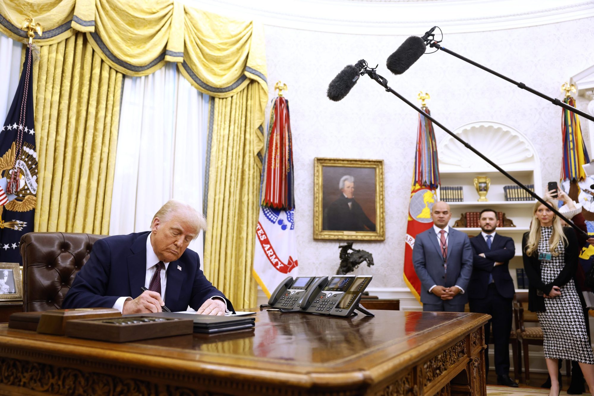 WASHINGTON, DC - JANUARY 23: U.S. President Donald Trump signs a series of executive orders in the Oval Office of the White House on January 23, 2025 in Washington, DC. Trump signed a range of executive orders pertaining to crypto currency, Artificial Intelligence, and clemency for anti-abortion activists. Photo by Anna Moneymaker/Getty Images