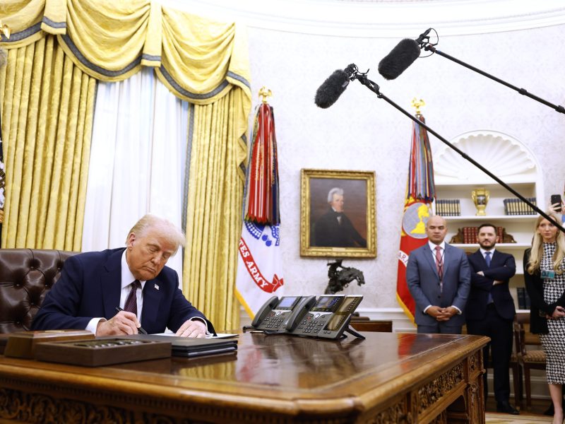 WASHINGTON, DC - JANUARY 23: U.S. President Donald Trump signs a series of executive orders in the Oval Office of the White House on January 23, 2025 in Washington, DC. Trump signed a range of executive orders pertaining to crypto currency, Artificial Intelligence, and clemency for anti-abortion activists. Photo by Anna Moneymaker/Getty Images
