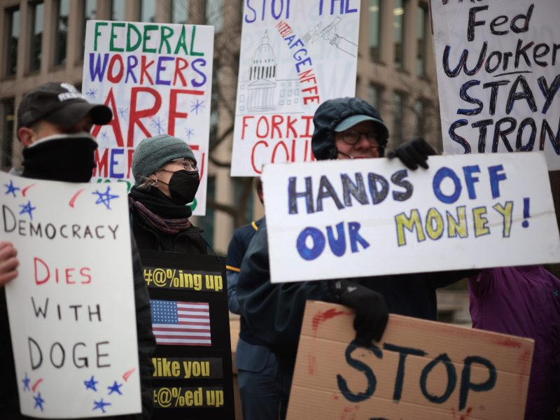 Protesters rally outside of the Theodore Roosevelt Federal Building headquarters of the U.S. Office of Personnel Management on February 05, 2025 in Washington, DC. Photo by Alex Wong/Getty Images
