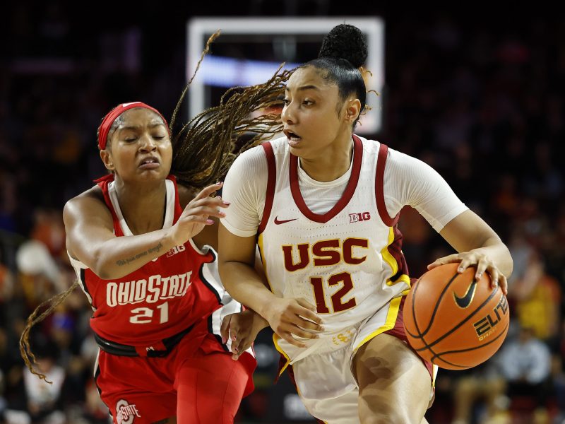 JuJu Watkins #12 of the USC Trojans controls the ball against Chance Gray #21 of the Ohio State Buckeyes in the second half at Galen Center on February 08, 2025 in Los Angeles, California. Photo by Ronald Martinez/Getty Images