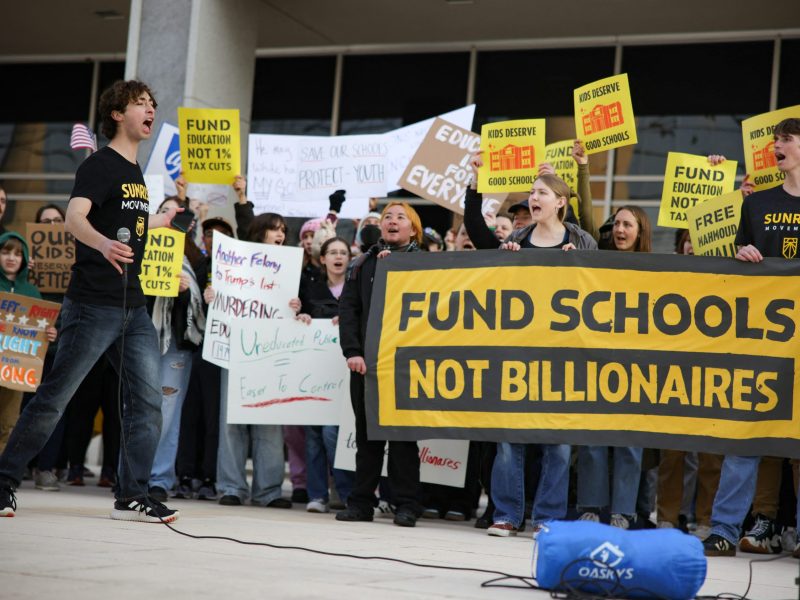 Demonstrators gather outside of the offices of the U.S. Department of Education in Washington, D.C. on March 13, 2025 to protest against mass layoffs and budget cuts at the agency, initiated by the Trump administration and DOGE. Photo by BRYAN DOZIER/Middle East Images/AFP via Getty Images