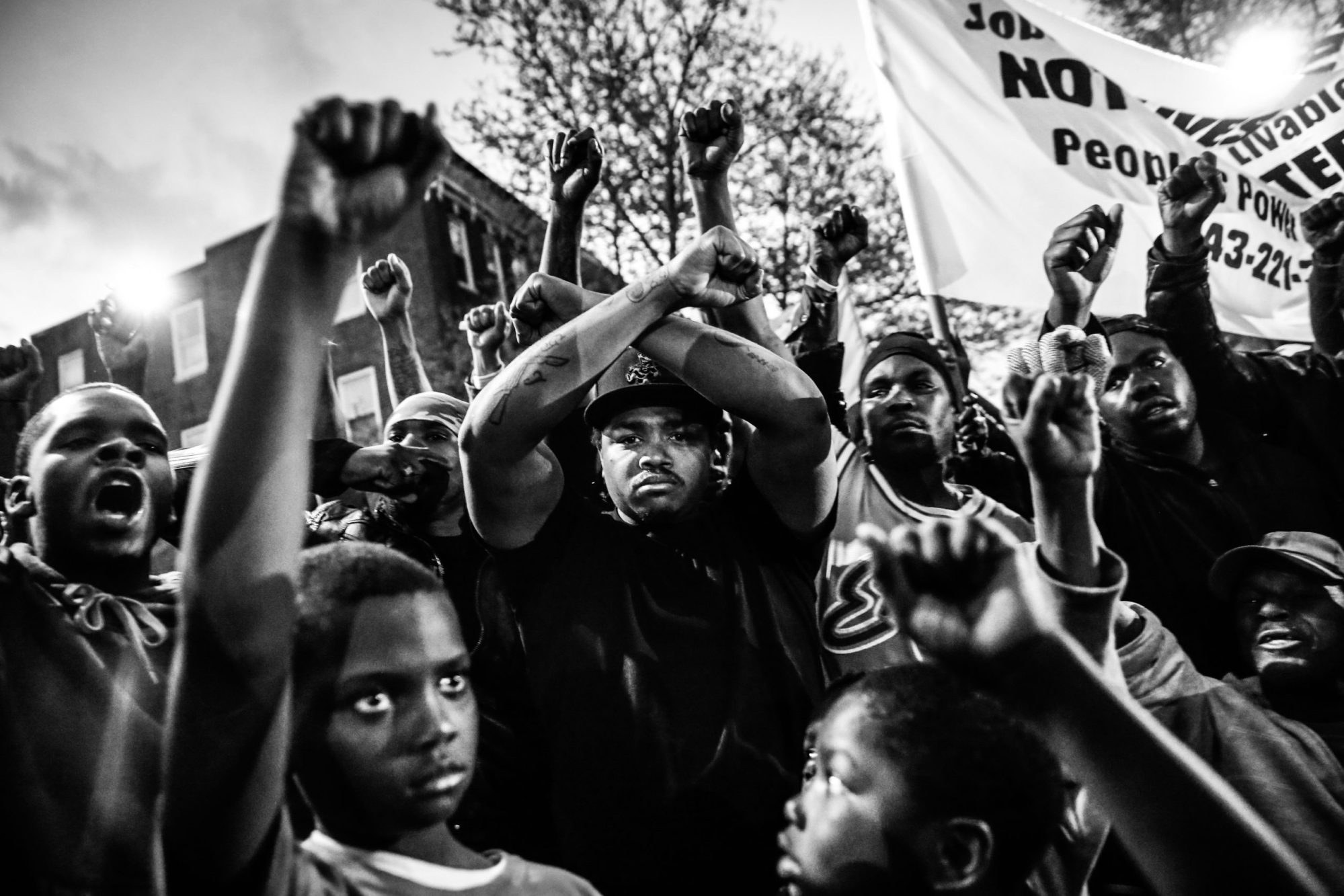 Protesters participate in a vigil for Freddie Gray down the street from the Baltimore Police Department's Western District police station, April 21, 2015, in Baltimore, Maryland. Photo by Drew Angerer/Getty Images.