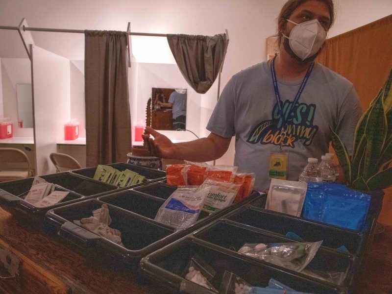 ﻿A harm reductionist provides a tour of a mock overdose prevention site.
