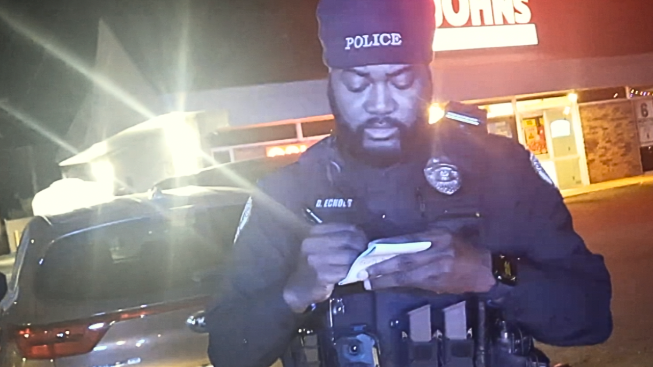 Jonesboro Arkansas police officer writes down information of pizza delivery driver during traffic stop. Photo: courtesy of Christian Mobley